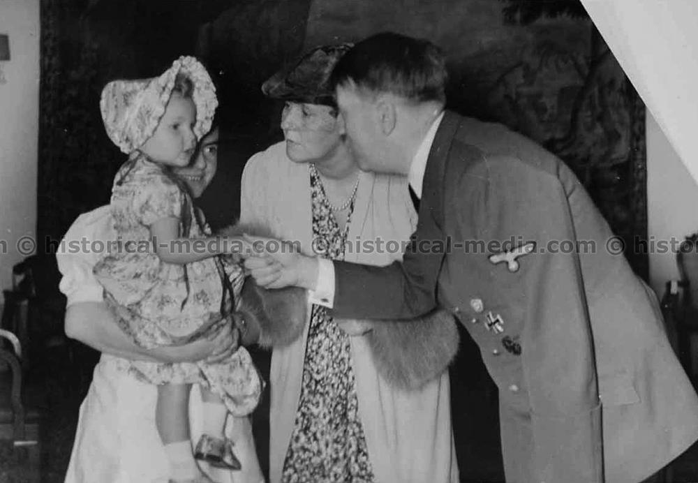 Adolf Hitler with his goddaughter Edda Göring and her mother Emmy Göring during a visit in Berlin's chancellery